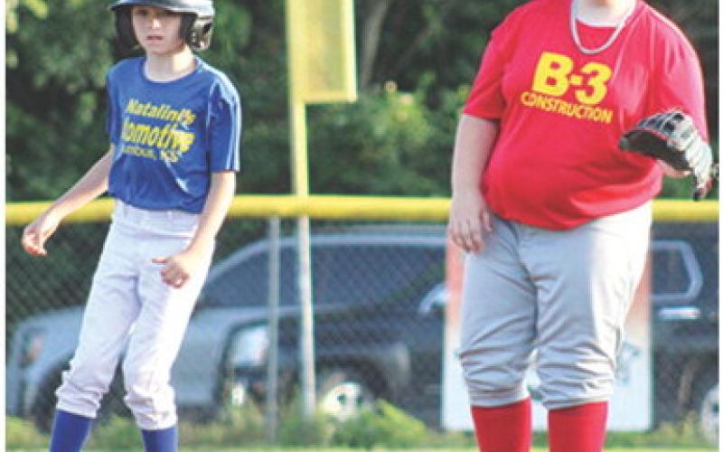 B-3 Construction’s third baseman, Ryker Saporito, holds the Natalini Automotive/ NAPA runner, Kalvin Davenport on base in the 10 and Under/Minor League game at Volunteer Field, Wednesday. ( Courtesy photo.)