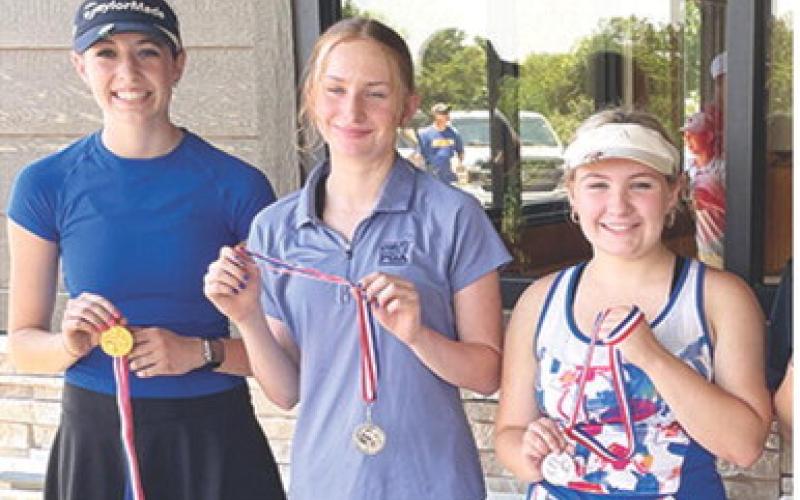 Caroline Scammon placed first in the SEK Junior Golf League season opener in Oswego, Tuesday. Caroline competed in the 7-8 year-old girls division shooting a 51. Natalie Wary was the winner of the 15 and over division in the season opener at Columbus for the older age groups with a round of 48. Avery Sells, Coffeyville, shot a 50 to place third and Amory Neely, Columbus, was third with a 54. Courtesy photos.