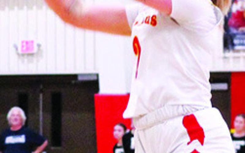 Lady Titan Senior, Graci Major, shoots one of her five, three pointers on the night in the 47-36, Columbus win over Frontenac, Tuesday, at the CUHS Gym. The victory sends the local round-ballers to the semi-final round of the Kansas Class 3A Sub-State Tournament in Caney, tonight, against Cherryvale