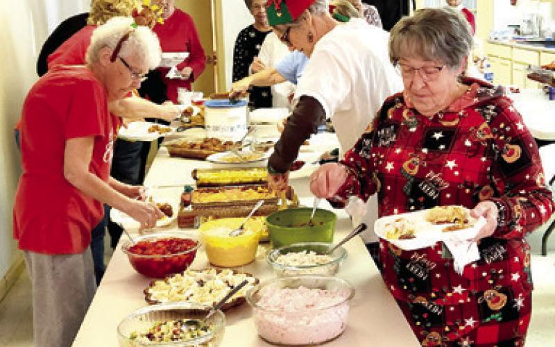 A potluck dinner and pajamas were on tap for the December 12 Bunco games. The players celebrated the Christmas season with food, fun and friendship.