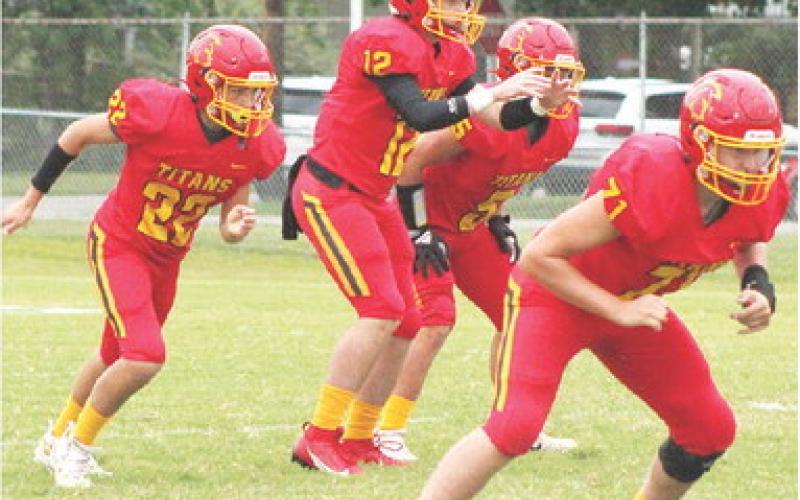 The Columbus Titan Offensive Backfield lined up for a play at Titan Stadium in a recent home game with sophomore, Jett Tanner at quarterback, freshmen, Trenton Lacen and Braun Stone as backs and junior, Kyler Rahmeier, offensive line. Columbus lost a tight, 12-14, battle in Galena, Monday night to the bulldogs.