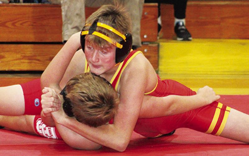 Titan Carlson Britt pinned his Carl Junction, Mo. opponent in 1:54 at the double dual hosted by the Columbus Junior High School Wrestling Team, Tuesday, at the CUHS Gymnasium. The Titans will be back on their home mats, tomorrow morning beginning at 9 a.m. for their annual invitational tournament.