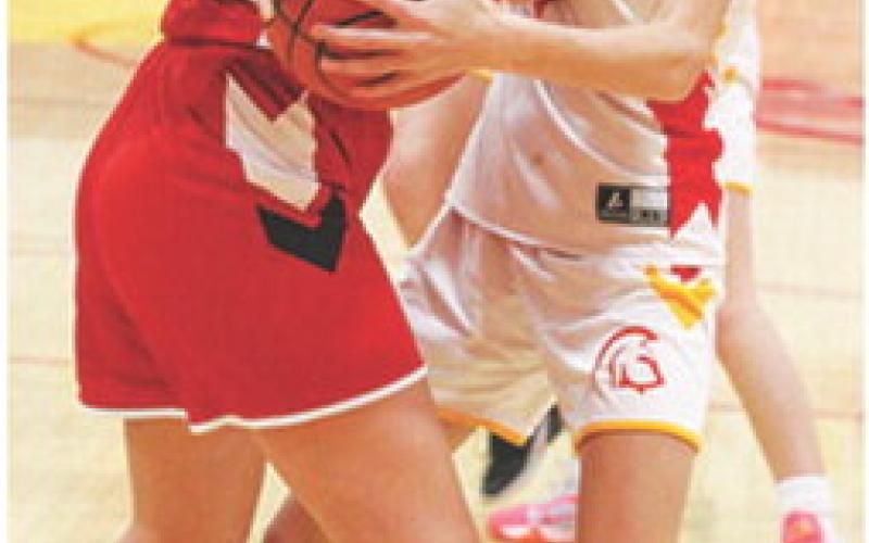 Reese Carter looks for a steal against Arma-Northeast, Saturday, at the Columbus Unified High School Gymnasium, during the annual Junior High School Jamboree.