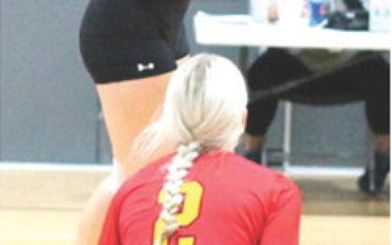Lady Titan Senior, KT Lopp, returns the ball over the net during the bracket play game against Chanute, Saturday, at the Frontenac High School Invitational Volleyball Tournament. The Lady Titans won two matches in three sets and lost three matches in a full day of volleyball action. Columbus will have another long day on the court in annual Oswego Tournament, tomorrow, beginning at 8 a.m.