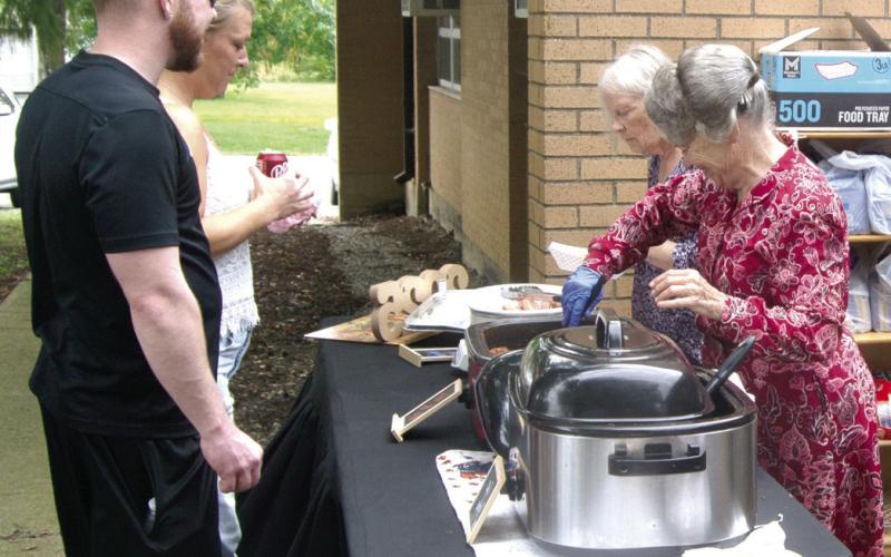 The never-ending food line was the most popular item at the Scammon Food Festival as they served hot dogs covered with chili.