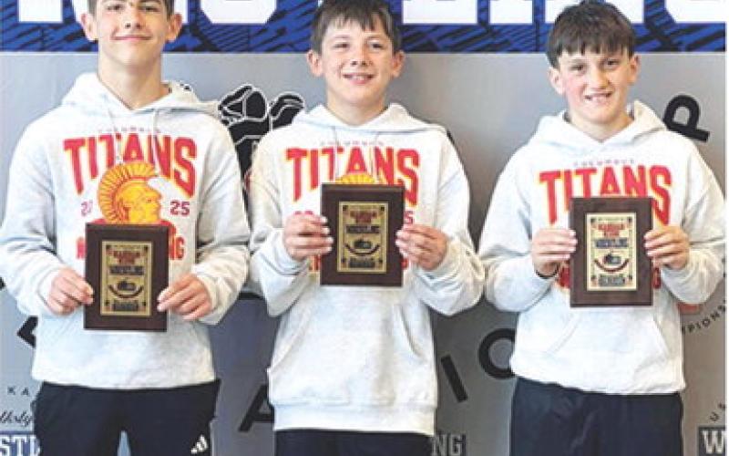 Blaze Bowman (14U, 100-pounds) and Cam Carter (12U, 95-pounds placed fifth in the USAWKS Kansas State Wrestling Tournament, March 14-15, in Topeka. Teammate, Briggs Johnson, placed sixth to earn a spot on the podium in the 10U 90-pound weight class. Courtesy photo.