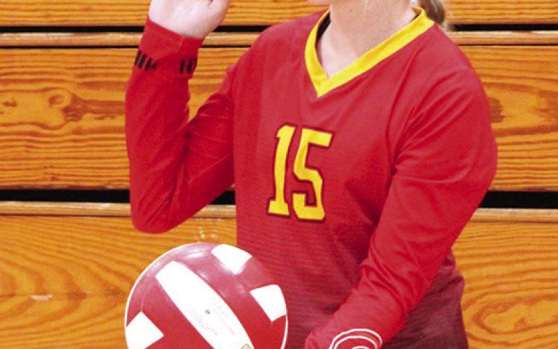 Lady Titan Landry Perry serves in the C game, Thursday at the CUHS Gymnasium.