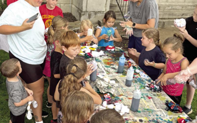 A bit of rain did not dampen the enthusiasm or spoil the fun for the youngsters at the library recently. Given white t-shirts, gloves and some dye children were encouraged to create a wearable masterpiece. A large number of youngsters showed up for the tie dye shirt event.