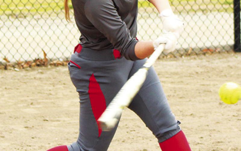 Kaitlynn (KT) Lopp, connected for a hit during practice, Thursday, March 23 at the Community Field Ballpark. Practice paid off when KT collected a pair of home runs during the Lady Titans season opener, Monday, in Altamont. The junior slugger also had a double to earn six RBIs and score three runs in the 17-1, Columbus win over Labette County.
