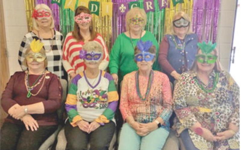 PEO celebrates Mardi Gras at meeting