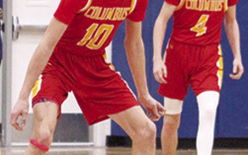 Titan Senior, Derek Krause, and sophomore, Cooper Bush, set up for defense in the final minutes of the Kansas Class 3A Sub-State quarterfinal loss to the Rams in Riverton, 47-69, Monday. Columbus ended their season with a 5-15 record. Riverton advanced to play Frontenac last night at Caney Valley High School. Scores were not available at press time.