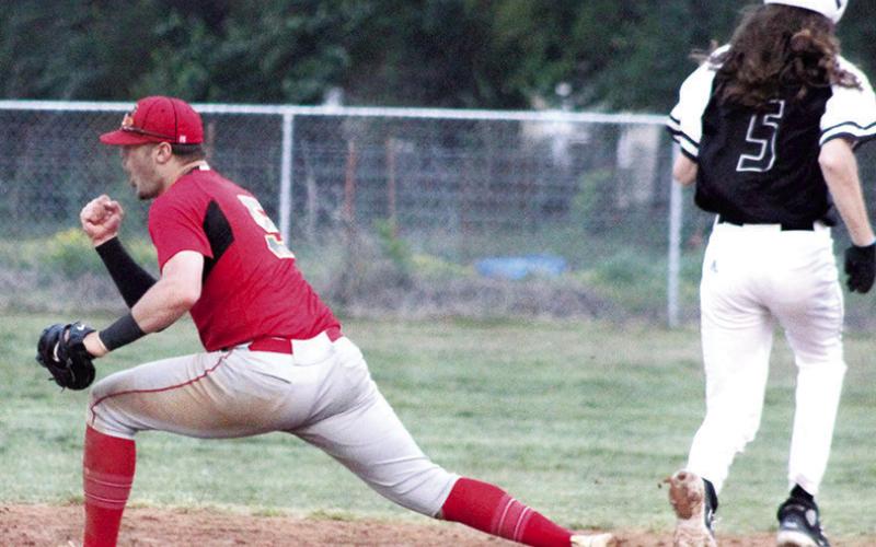 Titan Senior, Brett Hamilton, reacts to a 6-4-3 double play with the bases loaded to end the fifth inning for the Frontenac Raiders who were trailing, 6-4, in game two of the Columbus sweep over the undefeated Raiders, Friday, at Bomber Field. The Titans won game one, 6-5 and took game two, 11-4, to clinch the CNC League Title outright. Byrant Kitchens was the batter for Frontenac.