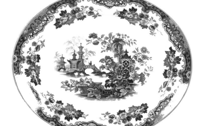 Printed Staffordshire pottery goes beyond blue transfers. This oval platter by Albion Pottery has colorful decorations reminiscent of Chinese porcelain. Photo Credit: Courtesy of DuMouchelles (c) 2025 by Cowles Syndicate Inc.