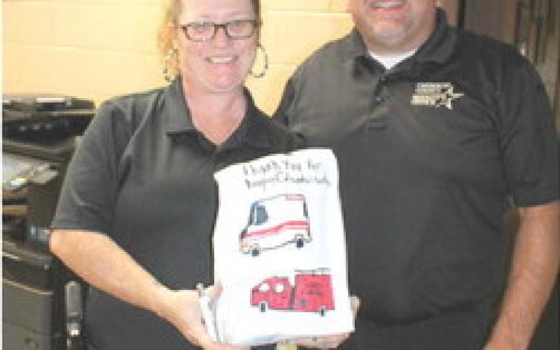 Juliana Miller and Sheriff David Groves received dinners from the Veterans and First Responders Appreciation Dinner Monday, September 11. Burgers, chips and a drink were provided to area veterans and first responders free of charge. Ronnie Robison and Kenny Coy dropped by the Veterans and First Responder Appreciation dinner September 11.