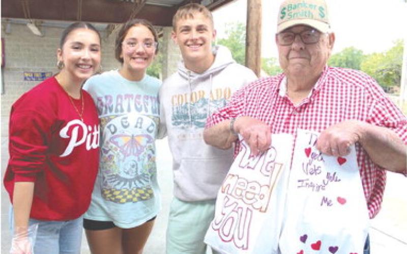 Presley Tedlock, Katy Mooney and Korbyn Newberry were on hand to distribute burgers, chips and drinks to area veterans and first responders at the appreciation Dinner Monday, September 11. Dewey Smith picked up his meals during lunch.