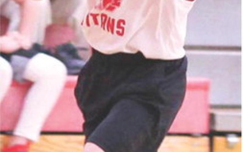 Columbus Fourth Grader, Lee Snow, goes up for a layup in the Recreation League win over Baxter Springs Youth Basketball, Saturday, at the Central School Gymnasium.