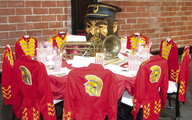 The USD 493 decorated table featured antique Titan Band uniforms as chair covers and the “Titan Man” along with some antique brass instruments.