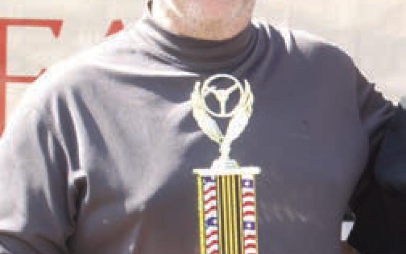 Jonah Bishop received the first place trophy for his 1973 De Tomeso Pantera in the 19601970 division at the 2024 Columbus Day Car Show.