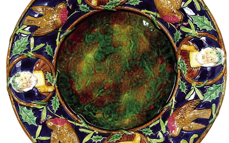 Victorian English majolica maker George Jones decorated this platter with English Christmas symbols that may be unfamiliar to Americans, but still have the spirit of the holiday. Photo Credit: Strawser Auction Group (c) 2024 by Cowles Syndicate Inc
