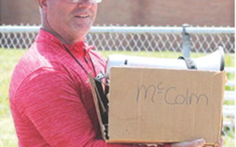 Columbus Elementary School Physical Education Coach, Heath Perry, had his hands full with the All-School Elementary Track and Field Meet Friday at Central School. Students in K-6 and teachers competed in various events from 9:30 a.m. to 2:30 p.m.