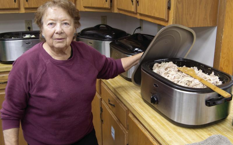 At the annual Community Christmas Dinner Virginia Leake was in charge of placing the turkey on all of the orders. The event had a large turnout and everyone had a nice selection of dishes for their meal.