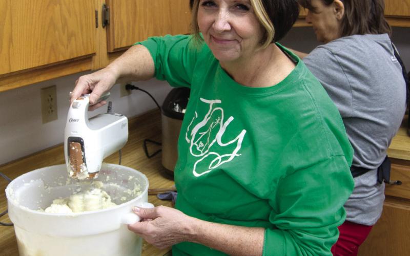 Julie Stover was busy making mashed potatoes for the annual Community Christmas dinner. The event was held as a drive thru and was well attended.