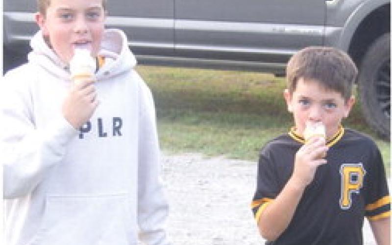 Alex and Lincoln Taylor end the evening at the Weir Homecoming Bean feed with a double dip ice cream cone.