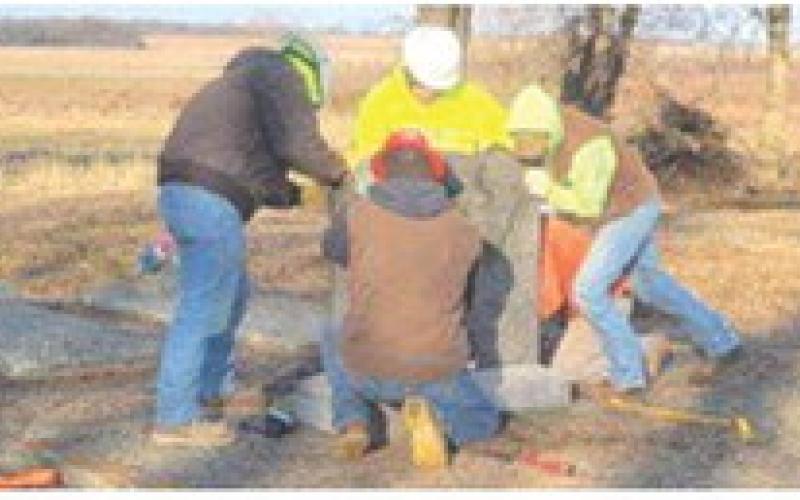 Frontenac High School students who are enrolled in Masonry in Fort Scott Community College’s CTEC program spent their morning December 20, repairing the vandalized headstones at Star Cemetery near West Mineral.