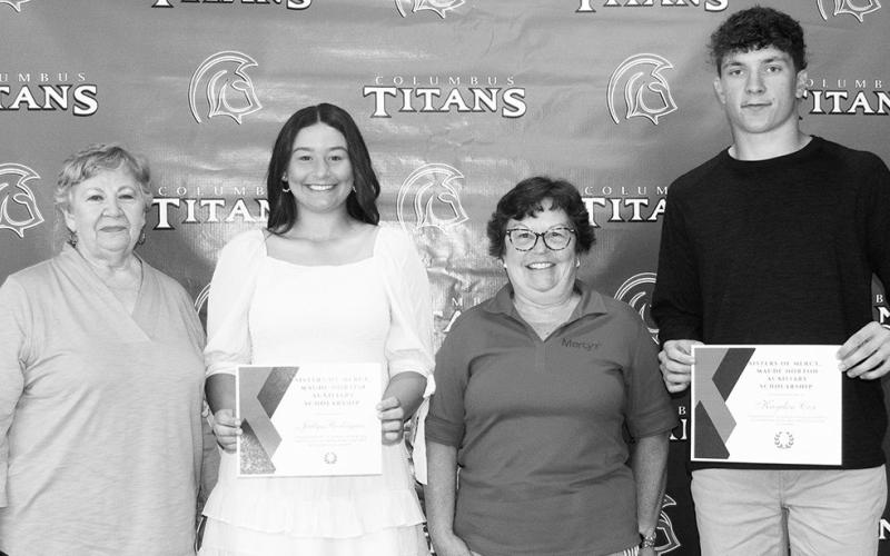 Jailyn Rodriguez and Kayden Cox received the Mercy Maude Norton Auxiliary Scholarship from Lucille McNemar and Janie Jarrett in the amount of $300 each during the Senior Assembly, May 19, at the Columbus Unified High School Gymnasium.