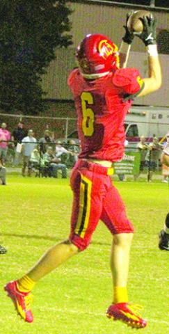 Titan Sophomore, Kooper Saiz, brings down a pass from senior quarterback, Jack Vilela, for a first down in the waning minutes of the second quarter during the 28-8, Columbus win over Galena, Friday at Titan Field. The Titans are now 2-0 on the season.