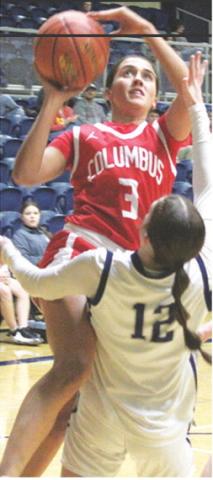 Lady Titan Senior, Brylie Johnson, goes up for two and gets an old-fashioned three on a foul by junior, Morgan Strong. Brylie finished with 15 points for Columbus in their, 43-37, win at Galena, Tuesday.