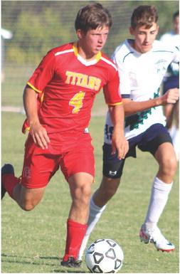Titan Dallas Scott drives the ball toward the Liberty Home School Goal during a recent match on the Central School home pitch. The Titans are still looking for their first win.