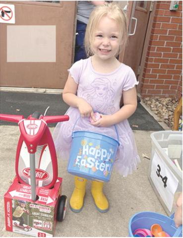 Grace Hodgson was a winner of a Golden Ticket at the Easter egg hunt at Medicalodges Friday afternoon.