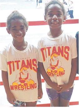 Kyra and Lyiah Lacen, members of the Columbus Wrestling Club placed sixth and fourth respectively in the Kansas Heartland Wrestling State Tournament, March 9, in Salina. Kyra and Lyiah compete in the six and under age group for the Titans. Courtesy photo.