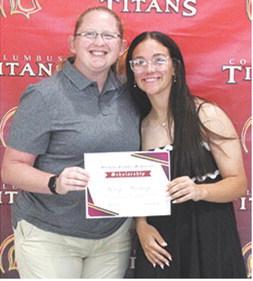 Katy Mooney received the Blanche Combs Memorial Scholarship in the amount of $100 from USD493 Instrumental Music Instructor, Christine Lovell, during the 2025 Senior Assembly at the Columbus Unified High School Gymnasium, May 16.
