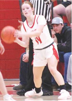 Lady Titan Junior, Bentley Townsend, looks to pass out to her teammate in Friday’s homecoming loss to St. Mary’s-Colgan, 15-72. Bentley had ten points in Friday’s loss and six in the win at St. Paul, Thursday.