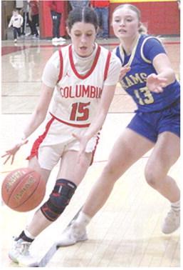 Lady Titan Sophomore, Natalie Wary, gets past her Riverton opponent in the February 4 loss to the Lady Rams. Columbus lost on the road at St. Mary’s-Colgan, Friday, 27-63.
