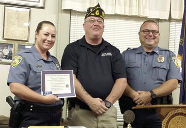 Rhanda Andrews was presented with the Baxter Springs American Legion Post 206 Officer of the year award. Legion Commander Darryl Nadeau presented the award at a recent meeting. She was nominated by Baxter Springs Police Chief Brian Henderson. Courtesy photo.