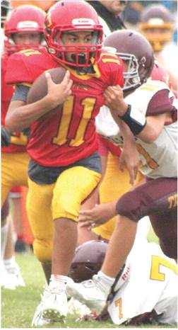 Titan Seventh Grader, Jayden Dohle, broke away for a 29-yard touchdown run for the final score of the game, increasing the Columbus win, 34-6, over the visiting Girard Trojans, Monday night at Titan Stadium. Dohle scored four touchdowns and two, twopoint conversions on the night.