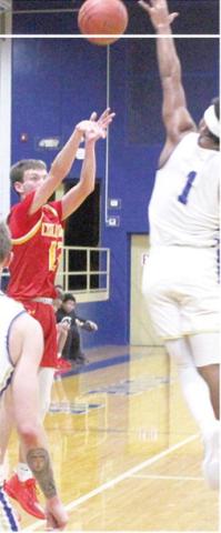 Titan Junior, Carter Woodcock had the lone threepoint basket for Columbus in their 38-73 loss in Riverton, December 19. Wookcock made this three over the outstreatched arm of junior, Aydin Witherspoon.