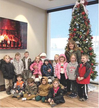 A special trip was in store for Suzette Henderson’s Park Elementary Kindergarten class. Santa Claus made a special early stop in Columbus to visit with youngsters. Class members were able to tell Santa what they wanted for Christmas and of course, get their photos taken with him to commemorate the day. Courtesy photo.