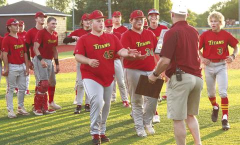 Columbus Titan Seniors, Jake Eddington and Robert Ward, receive the 2023 Kansas Class 3A Regional Championship plaque from the host Girard official, Wednesday, after defeating Frontenac, 9-5, in the championship game. The Titans (20-2, second seed) will face Kansas City-Bishop Ward (17-6), the seventh seed, Thursday, in the Kansas Class 3A State Quarterfinal game at Kansas State University’s Tointon Family Stadium in Manhattan.