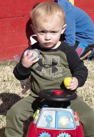 Winner in the youngest age division of the Chamber of Commerce Easter Egg Hunt was James Fields. He was trying out his prize.z-