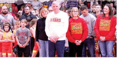 Long-time Columbus Titan Wrestling Coach, Ken Jones, was recognized during the local tournament that bears his name, the Ken Jones Classic, December 14, at the CUHS Gymnasium. In addition to the host of Columbus Wrestling Club current and past members, Ken was flanked by his sister, Karen Bowman, wife, Barbara, and daughter Ellen Lewis. (Not pictured are grand-daughter, Katherine Lewis, grandson, Kenneth Lewis, and son-in-law, Brad Lewis.