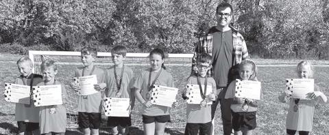 Two teams tied for first place honors in the seven and eight-year-old division of Columbus Youth Soccer League. The Calibrated/Folder Express team, coached by Brian Martin and Clint Ellis received their certificates and medals during the ceremony on the final day of games in October on Froebe Fields in Eddington Park. Team members are: Ezra Crozier, Wren Ellis, Harlee Fleming, Daygin Frobish, Kannon Kitterman, Jordan Lackamp, Camden Martin, and Oakleigh Mays. Courtesy photo.