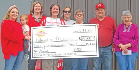 The Columbus Area Community Foundation recently presented a $25,000 dollar check to the Columbus museum for the new sports addition. Columbus Area Community Foundation members Christine Parsons, Jamie Robinson, Kelly Walters, and Maddy Foster were on hand as museum board members Anita Davolt, Ron Holmes and Ella Buzzard accepted the check. News Report photo by Shawn Churchill.