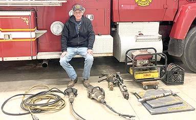West Mineral Fire Chief Randy Johnson surveys the extraction equipment his department received from the Columbus Fire and Rescue to help improve rescue service in the northern part of the county.