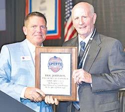 Former Columbus Titan Basketball Coach, Eric Johnson, was enshrined into the Missouri Sports Hall of Fame, in a ceremony February 1 with the Class of 2026. He received a commemorative plaque from Bob Marsh, President and CEO of the Hall of Fame during ceremonies in Springfield, Mo. Photo courtesy of Miles Boyer Photography.