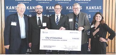 Columbus City Council member Tom Pryor, City Administrator Jake Letner, Mayor Grant Spieth were in Topeka last week to officially receive a $650,000 CDBG award. The check was presented by Lt. Gov. David Toland, and Brytonee Kepley a grants specialists with CBDG. These funds will support sewer improvements designed to reduce stormwater inflow and infiltration while enhancing the overall functionality of the system. Courtesy photo.