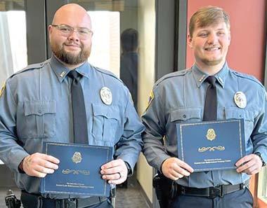 Two officers with Baxter Springs Police Department recently graduated from the police academy. Nigel Garner and Luke Gunn will now be patrolling in Baxter SprCinogusr.t esy photo.